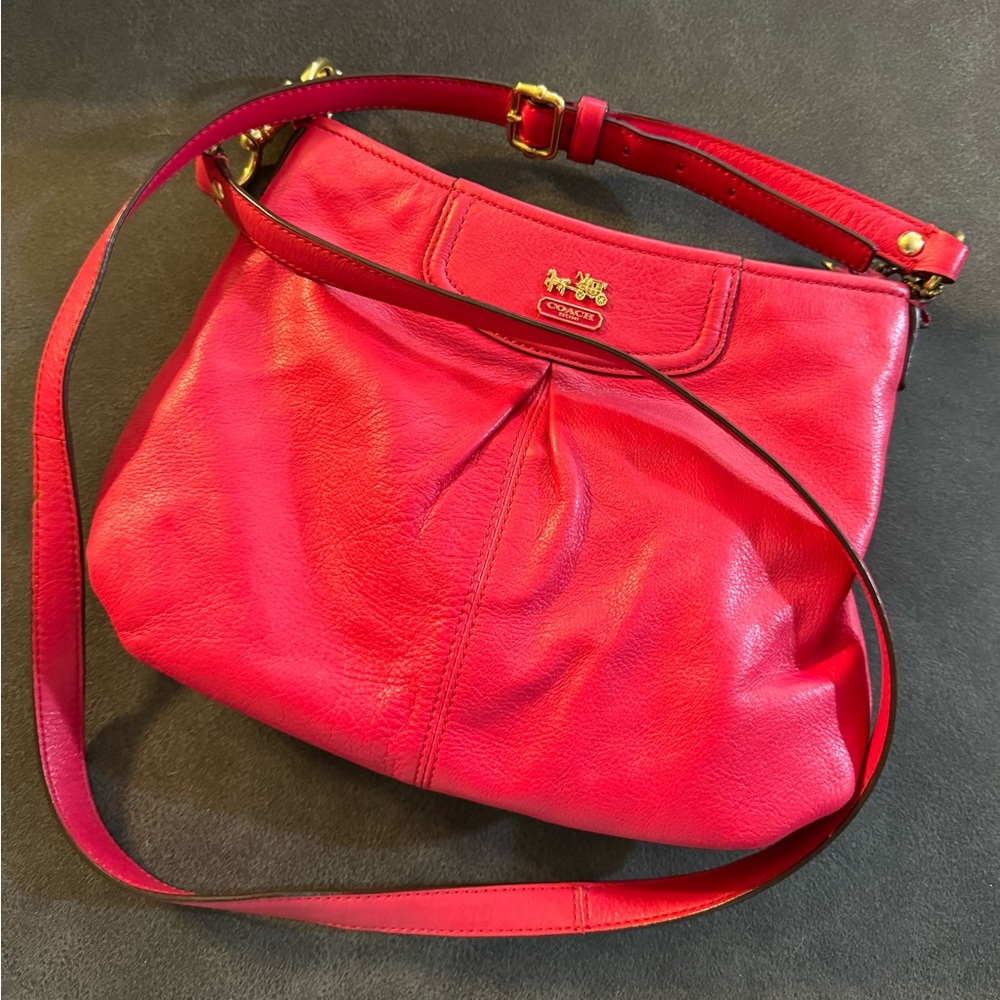 Coach fuchsia color crossbody leather purse.